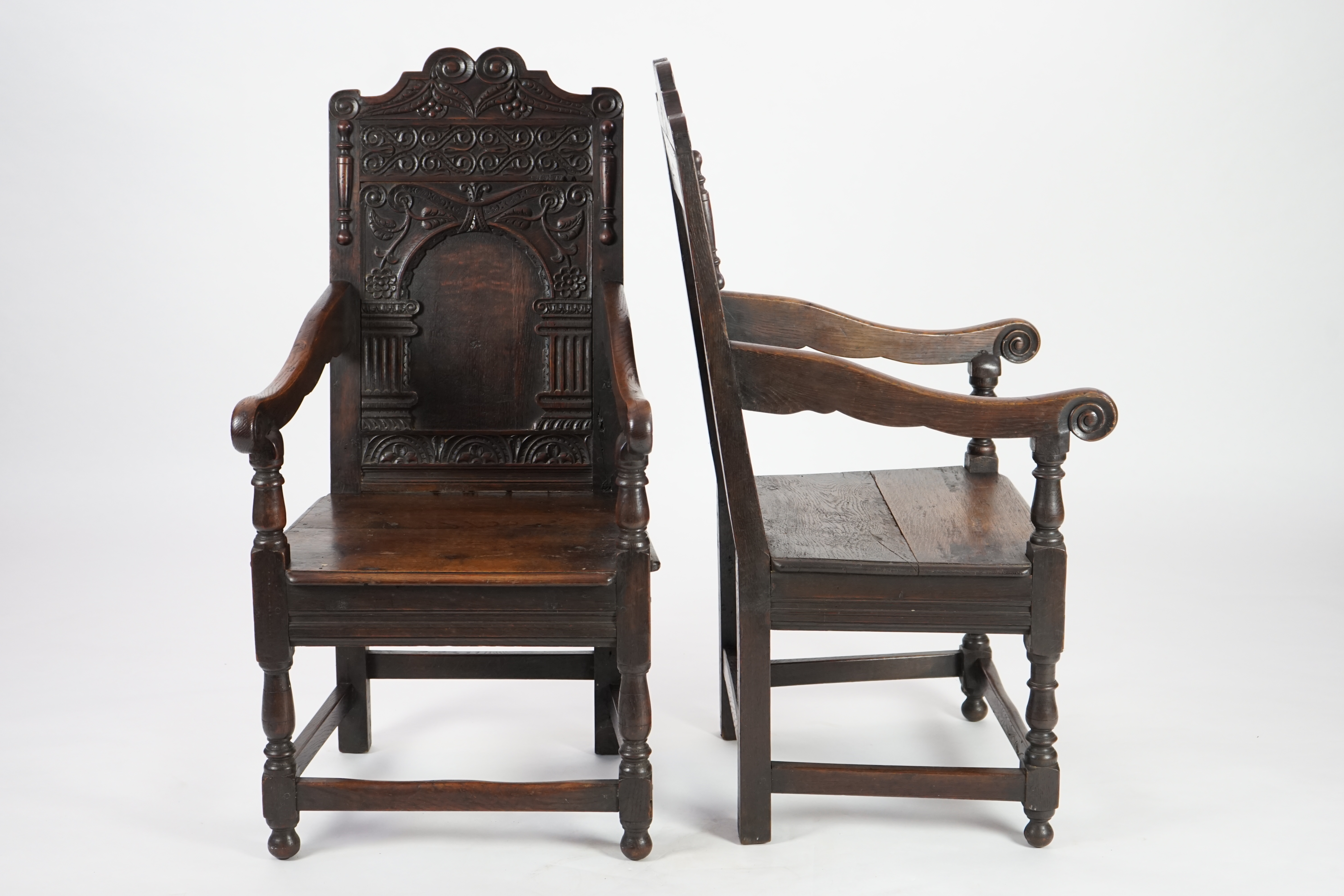 A pair of 17th century style oak Wainscot chairs